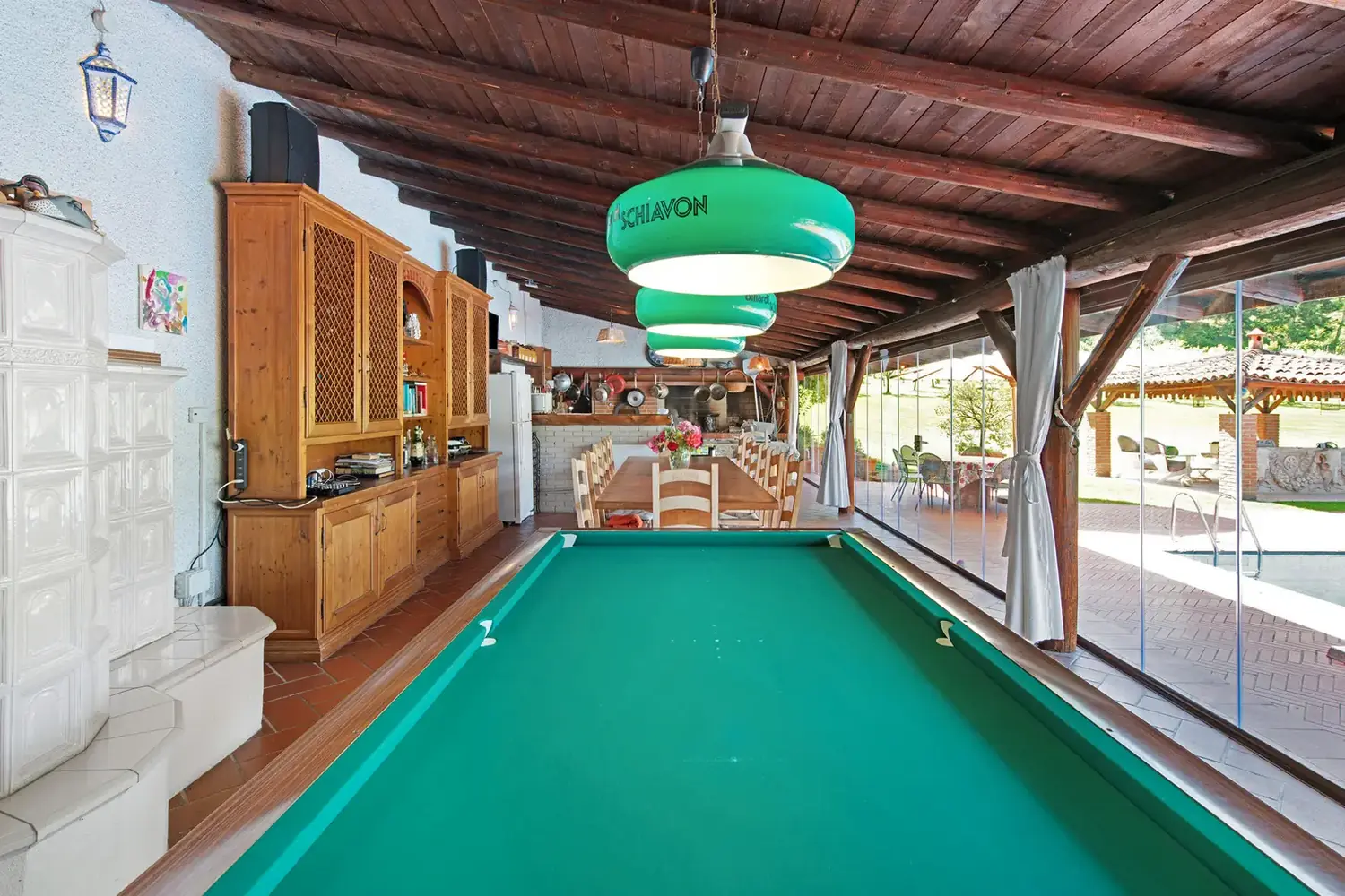 Billiard table and living area in the pool dependance at Cavallina Retreat